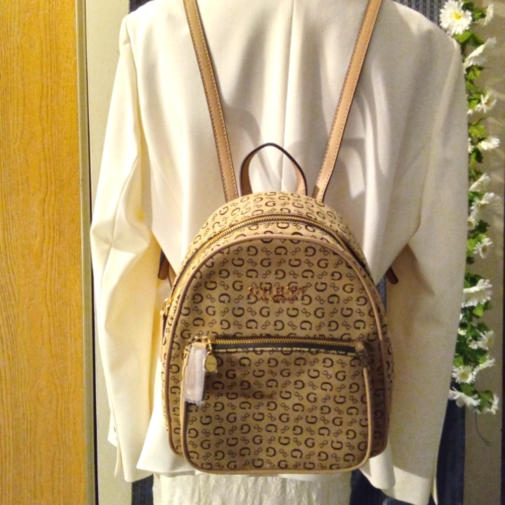 Guess backpack handbag, brown in color with leather straps